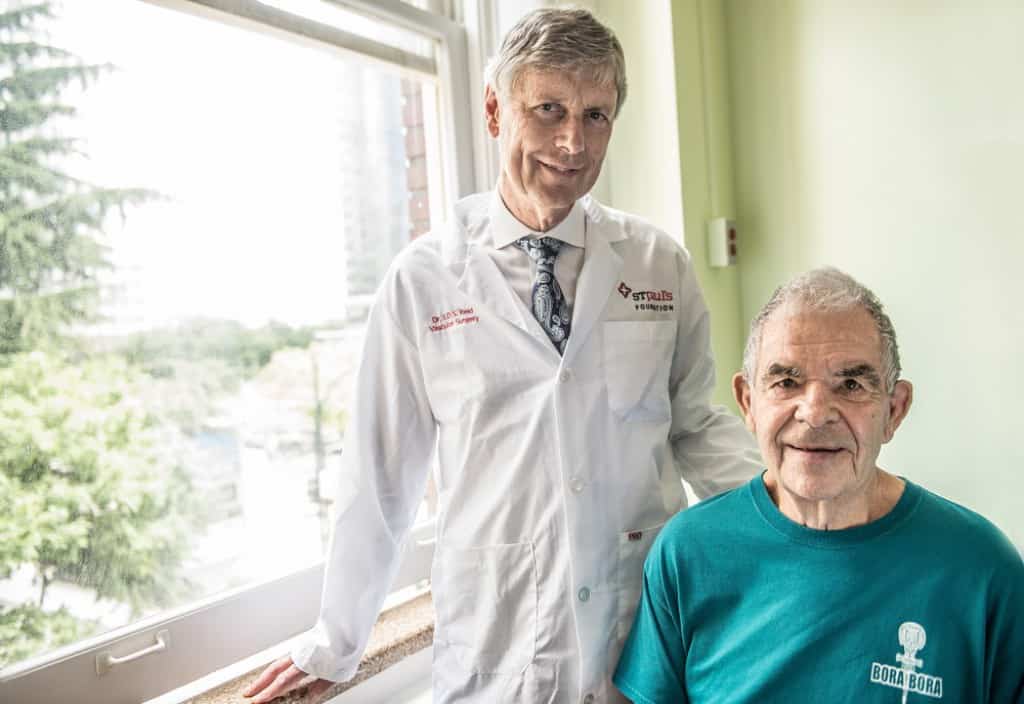 Portrait of Dr. Reid, a vascular specialist and co-developer of the Sladen-Reid technique, which utilizes targeted foam compression to treat chronic venous insufficiency.